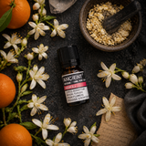 10 ml Pure Neroli Essential Oil — overhead lifestyle flat lay
