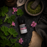 10 ml Geranium Essential Oil — overhead lifestyle flat lay