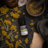Helichrysum Essential Oil 10ml — overhead lifestyle flat lay