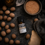 10 ml Nutmeg Essential Oil — overhead lifestyle flat lay